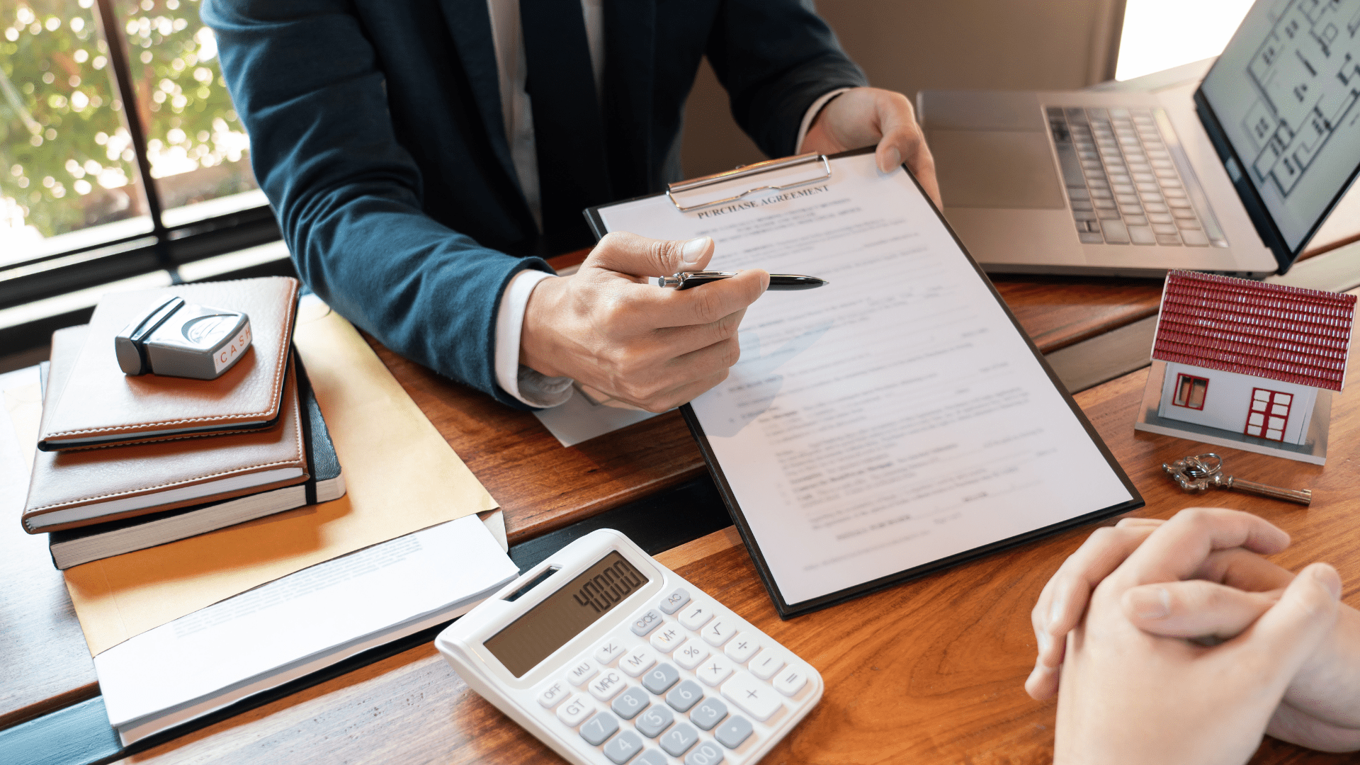 Man showing document of details about investment property purchase